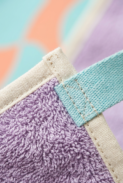 Close-up of lavender woven fabric and ivory binding