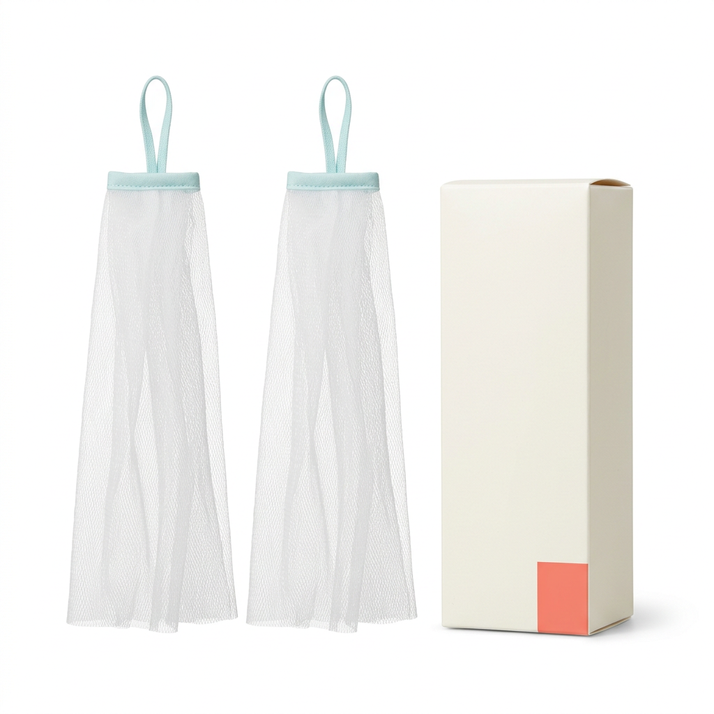 Two white foaming nets with aqua loops and ivory carton on white background
