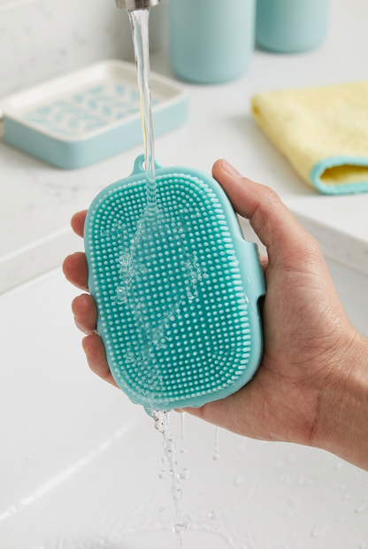Aqua body brush being rinsed over a basin