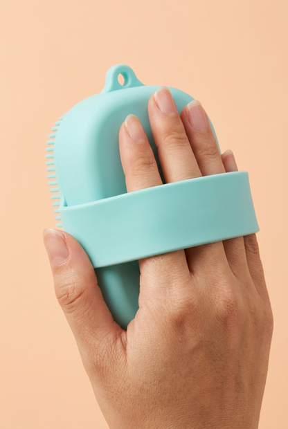 Hand positioned under the body brush back strap