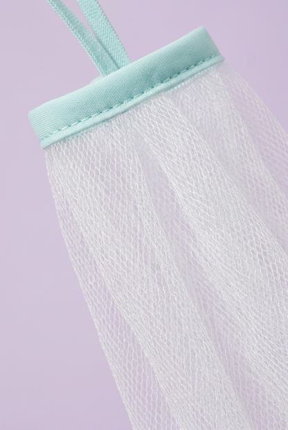 Close-up of white mesh and aqua binding